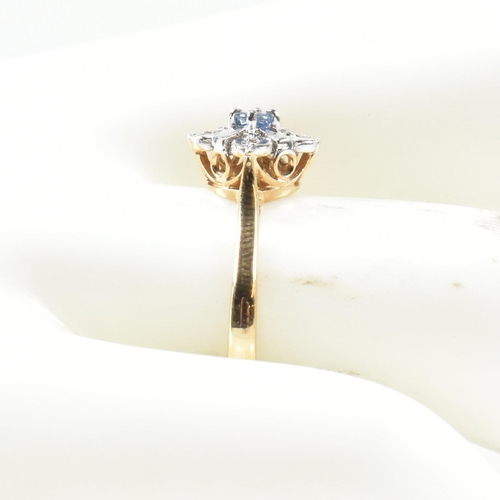 431 - A hallmarked 9ct gold, sapphire and diamond cluster ring. The ring set with a central round cut sapp... 