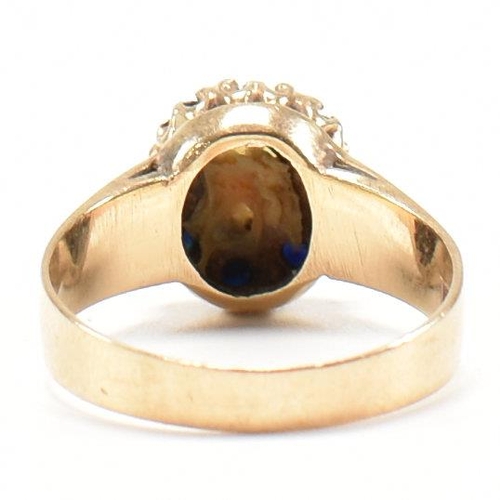 432 - A hallmarked 9ct gold, sapphire and opal cluster ring. The ring set with a central opal cabochon and... 