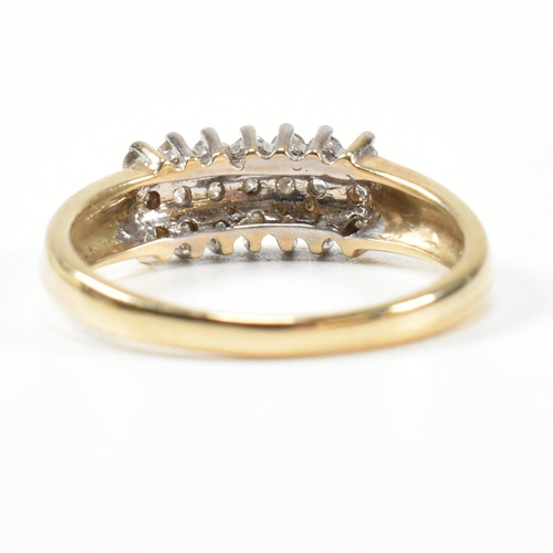 433 - A 9ct gold and diamond cluster ring. The ring set with three rows of round cut diamonds with fluted ... 