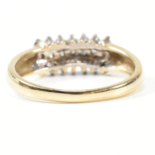 433 - A 9ct gold and diamond cluster ring. The ring set with three rows of round cut diamonds with fluted ... 