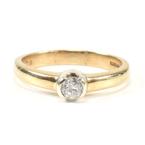 434 - A hallmarked 9ct gold and diamond solitaire ring. The ring set with a single half bezel set round br... 