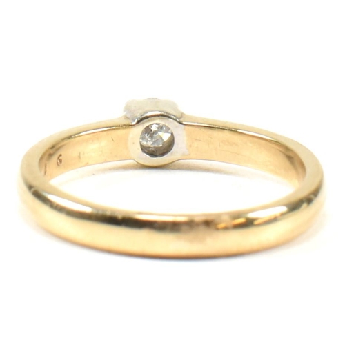 434 - A hallmarked 9ct gold and diamond solitaire ring. The ring set with a single half bezel set round br... 