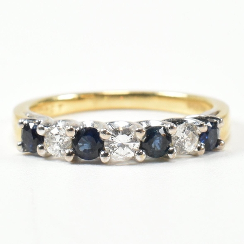 437 - A hallmarked 18ct gold, diamond and sapphire half hoop ring. The ring set with three shared claw rou... 