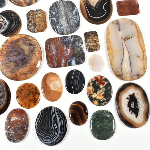 438 - A collection of banded agate, moss agate, bloodstone and jasper specimen slices. Largest 10.7cm. Tot... 