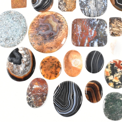 438 - A collection of banded agate, moss agate, bloodstone and jasper specimen slices. Largest 10.7cm. Tot... 