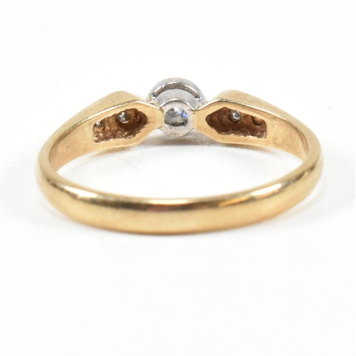 440 - A hallmarked 9ct gold and diamond ring. The ring set with a central bezel set round brilliant cut di... 