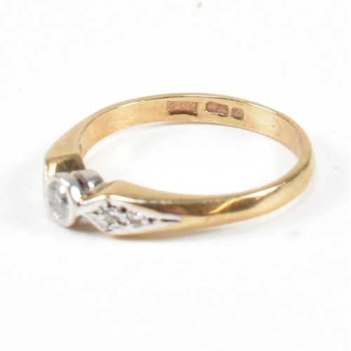 440 - A hallmarked 9ct gold and diamond ring. The ring set with a central bezel set round brilliant cut di... 