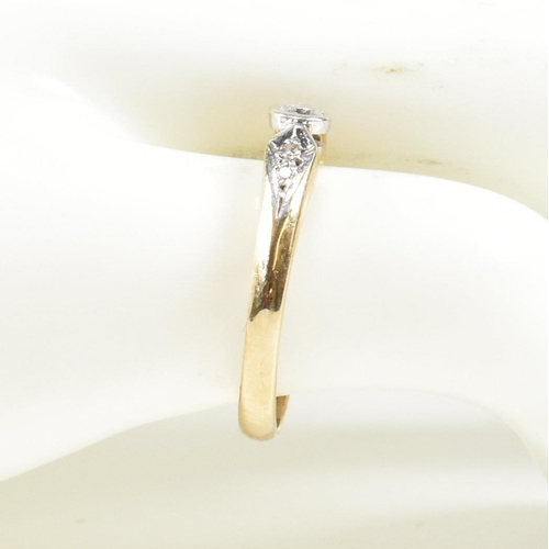 440 - A hallmarked 9ct gold and diamond ring. The ring set with a central bezel set round brilliant cut di... 