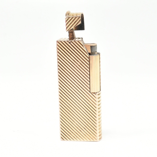 447 - A vintage Dunhill Paris gold plated lighter. The lighter having chevron decoration with roller actio... 