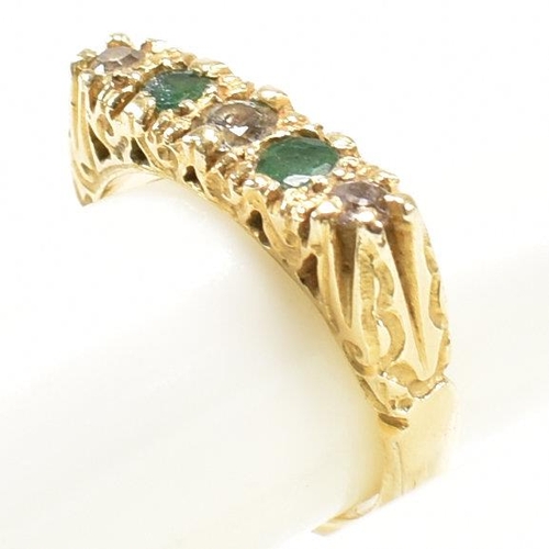 449 - 18ct gold emerald and diamond five stone ring. The ring set with two round brilliant cut emeralds an... 