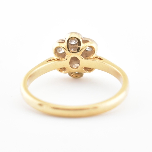 45 - A hallmarked 18ct gold and diamond cluster ring. The ring set with 7 diamonds, estimated diamond wei... 