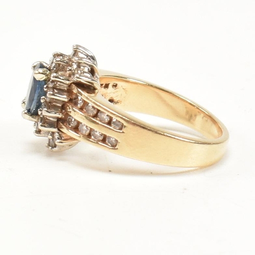 450 - A 14ct gold sapphire and diamond cluster ring. The ring set with an oval cut sapphire framed by roun... 