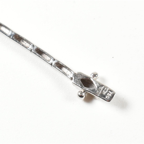 46 - A hallmarked 18ct white gold and diamond line necklace. The necklace having a single row of round cu... 