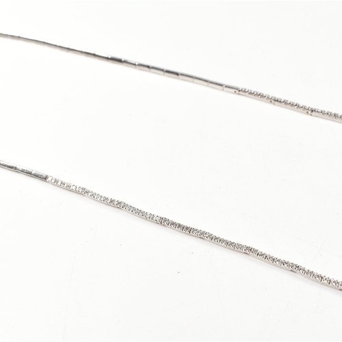 46 - A hallmarked 18ct white gold and diamond line necklace. The necklace having a single row of round cu... 