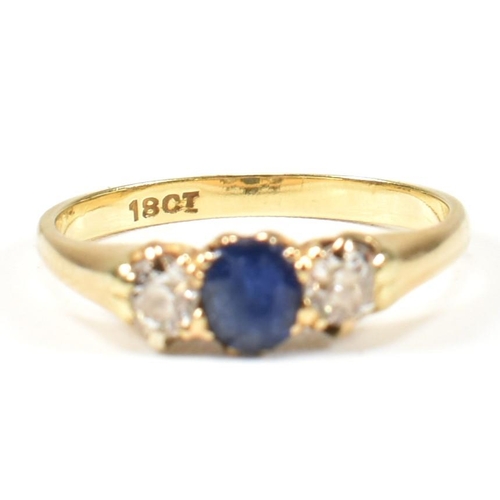 48 - An 18ct gold sapphire & diamond three stone ring. The ring set with a central sapphire flanked by tw... 