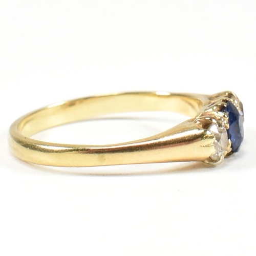 48 - An 18ct gold sapphire & diamond three stone ring. The ring set with a central sapphire flanked by tw... 