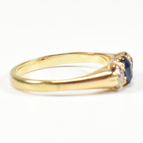 48 - An 18ct gold sapphire & diamond three stone ring. The ring set with a central sapphire flanked by tw... 