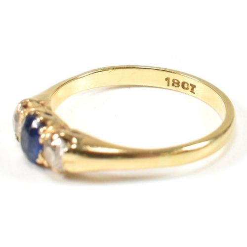 48 - An 18ct gold sapphire & diamond three stone ring. The ring set with a central sapphire flanked by tw... 