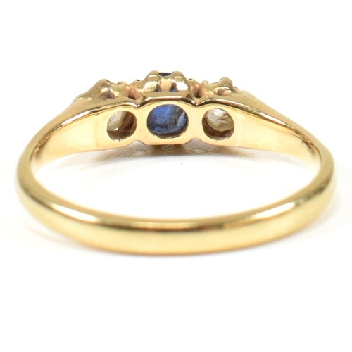 48 - An 18ct gold sapphire & diamond three stone ring. The ring set with a central sapphire flanked by tw... 