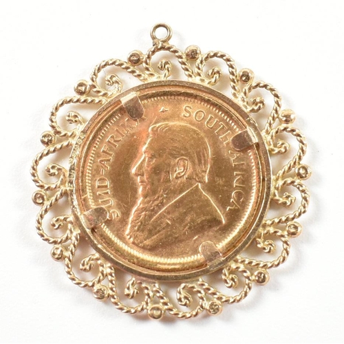 49 - A hallmarked 9ct gold mounted 1/10 OZ Krugerrand 1981 mounted necklace pendant. The pendant formed w... 