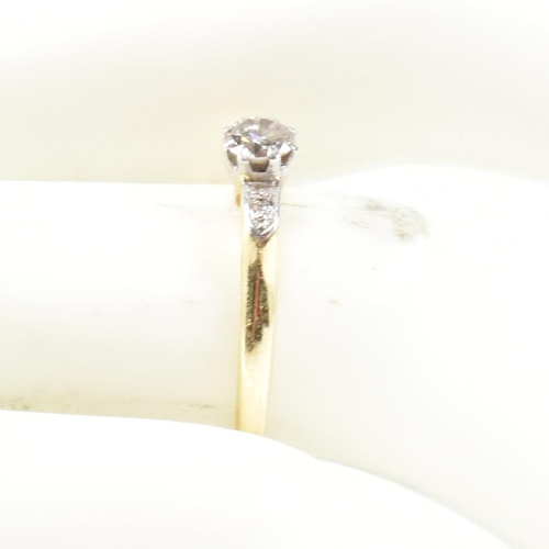 52 - An 18ct gold and diamond solitaire ring. The ring set with a single round brilliant cut diamond havi... 