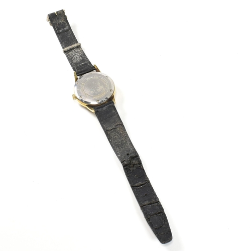 59 - A vintage J. W. Benson London Swiss made wristwatch. The watch having a circular silvered dial with ... 