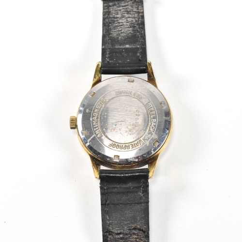 59 - A vintage J. W. Benson London Swiss made wristwatch. The watch having a circular silvered dial with ... 