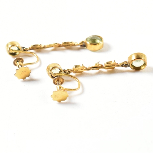 6 - An Edwardian 9ct gold peridot and pearl necklace and earring suite. The fringe necklace having bezel... 