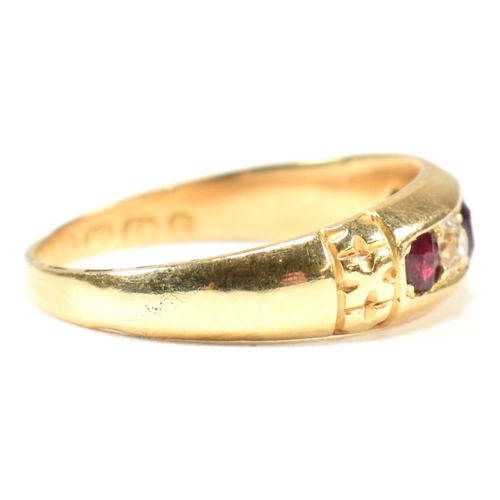 61 - A Victorian 18ct gold ruby and diamond five stone ring. The ring set with three round cut rubies and... 