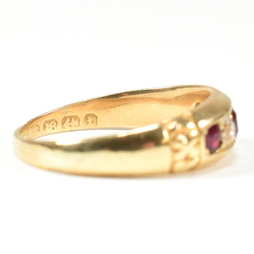 61 - A Victorian 18ct gold ruby and diamond five stone ring. The ring set with three round cut rubies and... 