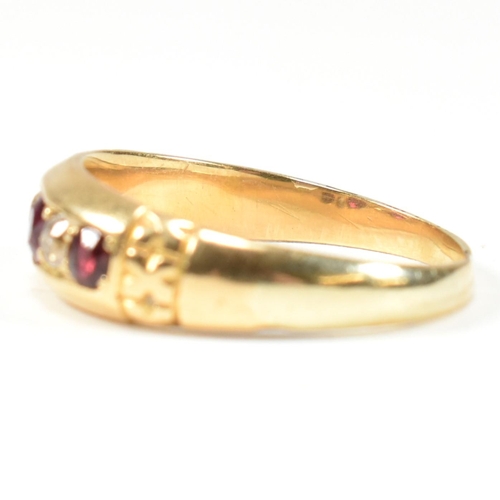 61 - A Victorian 18ct gold ruby and diamond five stone ring. The ring set with three round cut rubies and... 