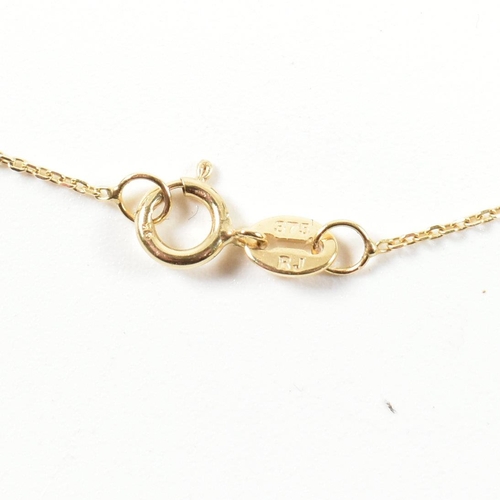 62 - A 9ct gold and diamond pendant necklace. The necklace strung with a pendant in the form of a snake e... 