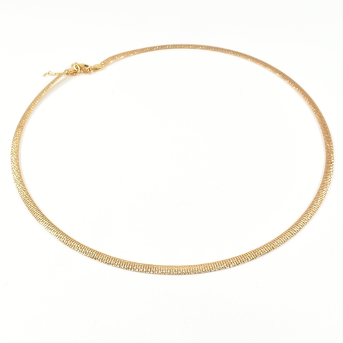 63 - A hallmarked 9ct gold flat textured snake chain necklace. The necklace having a 9ct gold textured me... 