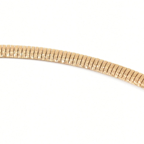 63 - A hallmarked 9ct gold flat textured snake chain necklace. The necklace having a 9ct gold textured me... 