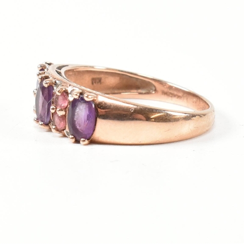 65 - A hallmarked 9ct rose gold, diamond, amethyst and tourmaline ring. The ring set with three oval cut ... 