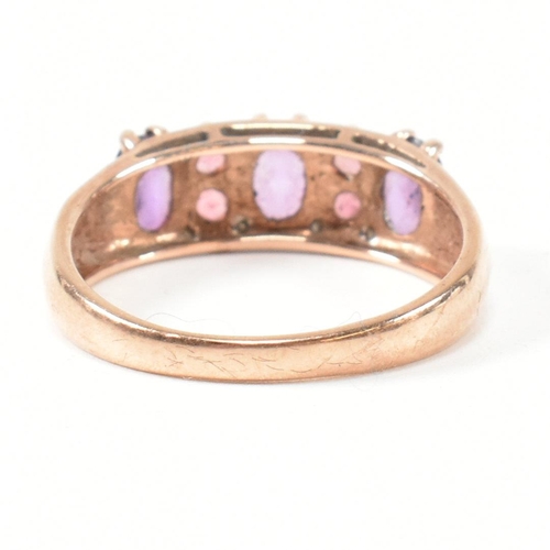 65 - A hallmarked 9ct rose gold, diamond, amethyst and tourmaline ring. The ring set with three oval cut ... 