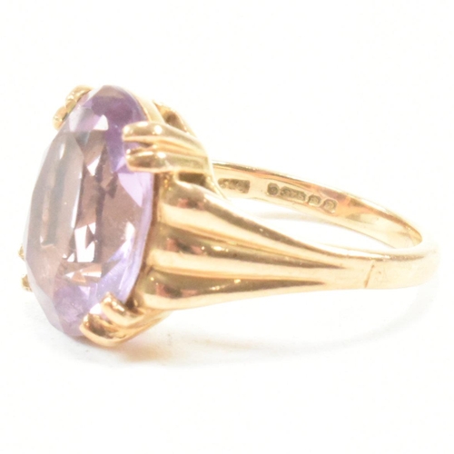 66 - A vintage hallmarked 9ct yellow gold and amethyst solitaire ring. The single stone dress ring having... 