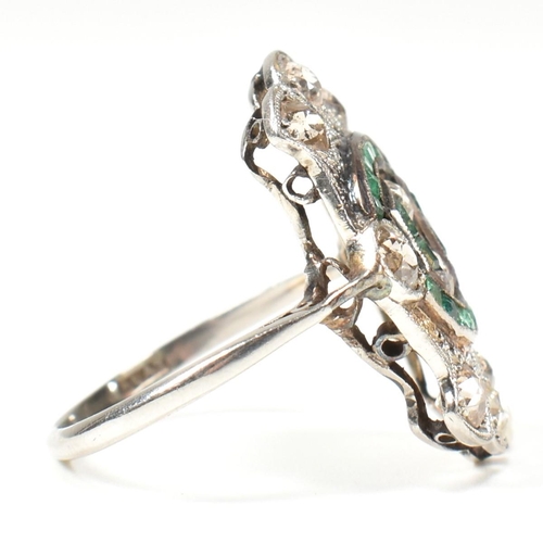 7 - An Art Deco platinum emerald and diamond ring. The ring set with calibre cut emeralds and old cut di... 