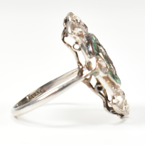 7 - An Art Deco platinum emerald and diamond ring. The ring set with calibre cut emeralds and old cut di... 