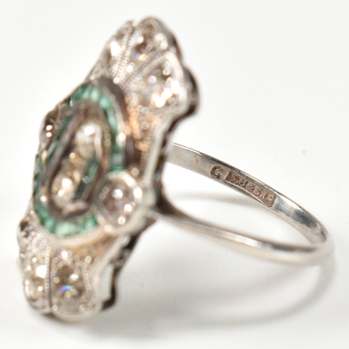 7 - An Art Deco platinum emerald and diamond ring. The ring set with calibre cut emeralds and old cut di... 