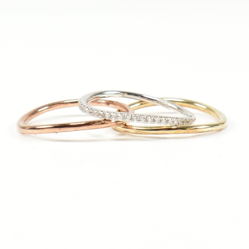 73 - A hallmarked 9ct gold and diamond tri colour gold stacking ring set. Size N. Weighs 3.2g. All weight... 