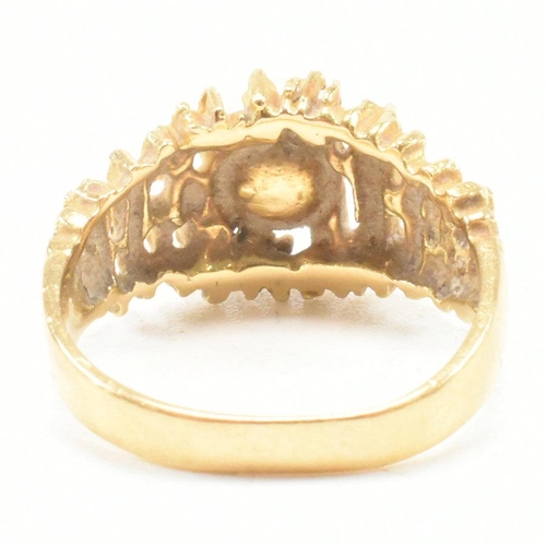 74 - A vintage 18ct yellow gold and pearl dress ring. The brutalist style ring having a pierced bark effe... 