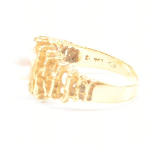 74 - A vintage 18ct yellow gold and pearl dress ring. The brutalist style ring having a pierced bark effe... 