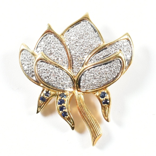 76 - A hallmarked 18ct gold, sapphire and diamond lotus flower brooch pin. The lotus flower brooch pin ha... 