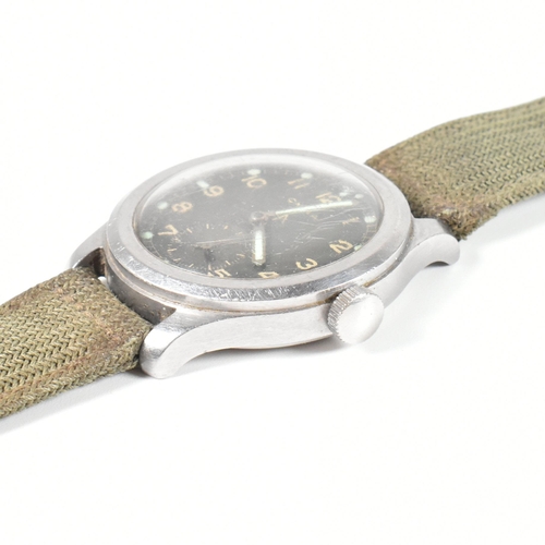 77 - A World War II military Cyma Dirty Dozen wristwatch. The watch having a circular black dial with rad... 