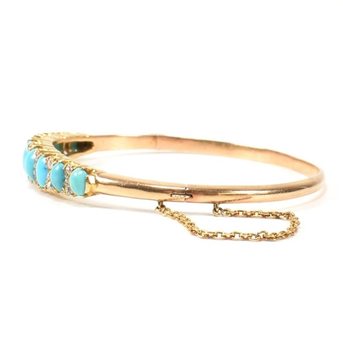 8 - A late Victorian gold, turquoise and diamond hinged bangle. The gold hinged bangle set with nine gra... 