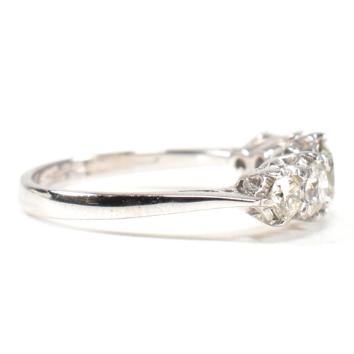 82 - A white gold and diamond five stone ring. The ring set with five graduating round brilliant cut diam... 