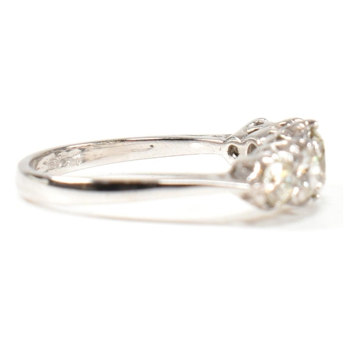 82 - A white gold and diamond five stone ring. The ring set with five graduating round brilliant cut diam... 