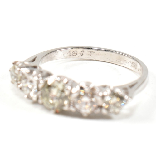 82 - A white gold and diamond five stone ring. The ring set with five graduating round brilliant cut diam... 