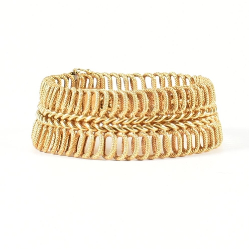 85 - A hallmarked Italian 18ct gold woven link bracelet. The 18ct gold bracelet having a central woven ch... 